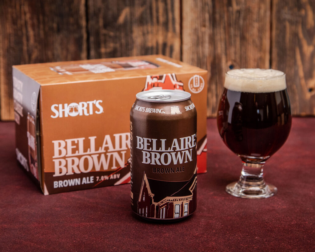 Photo of a beer can, six pack, and pint of Bellaire Brown ale