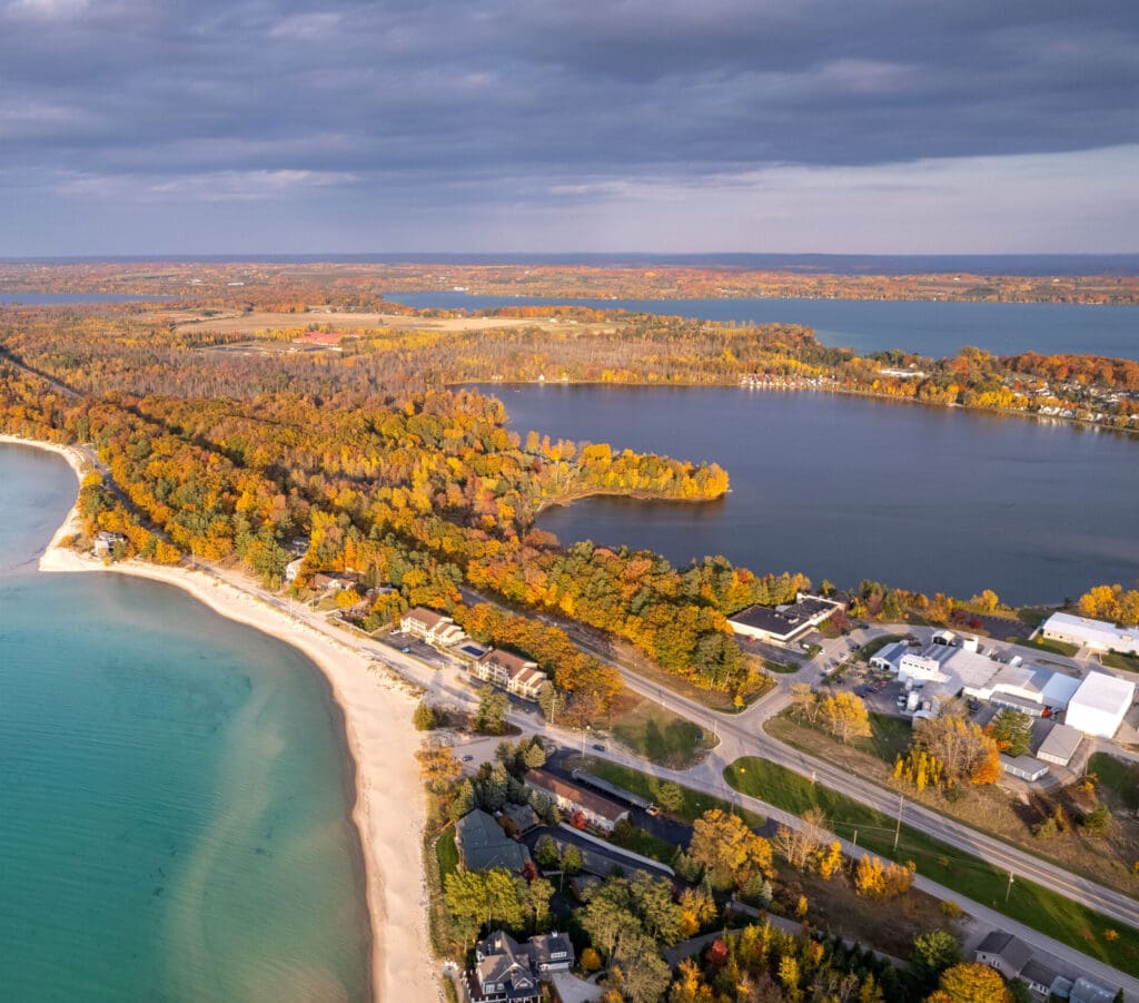 Aerial photo of the Short's Elk Rapids production facility showing Lake Michigan, Elk Lake, and Birch Lake