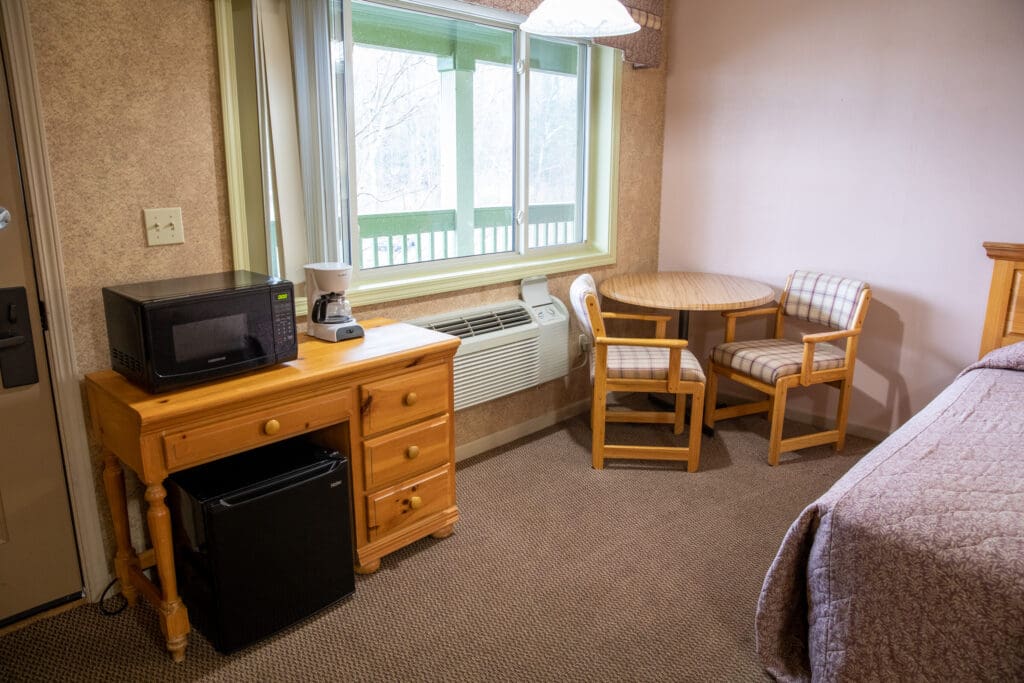 Photo showing various seating near a hotel room window